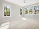Bright bedroom with three windows provides ample natural light and views of the outdoors at 4005 Brevard Pl, Raleigh, NC 27609