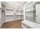 Large walk-in closet with custom shelving and hardwood floors at 4005 Brevard Pl, Raleigh, NC 27609