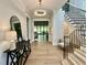 Elegant foyer features hardwood floors, staircase, and modern lighting at 4005 Brevard Pl, Raleigh, NC 27609