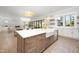 Well-appointed kitchen with a large island, custom cabinets, and modern lighting, perfect for culinary enthusiasts at 4005 Brevard Pl, Raleigh, NC 27609
