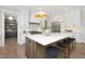 Bright, modern kitchen featuring a large island with seating and stainless steel appliances at 4005 Brevard Pl, Raleigh, NC 27609
