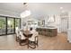 Bright kitchen with a large island, modern appliances, and seamless access to the dining area at 4005 Brevard Pl, Raleigh, NC 27609