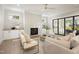Cozy living room featuring a marble fireplace, built-in cabinets, and comfortable seating at 4005 Brevard Pl, Raleigh, NC 27609