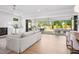 Open concept living space flows to covered patio through folding doors at 4005 Brevard Pl, Raleigh, NC 27609