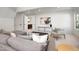 Inviting living room showcasing neutral decor, a cozy sectional, and access to other rooms through elegant doorways at 4005 Brevard Pl, Raleigh, NC 27609