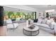 Comfortable living room opening to outdoor patio and modern kitchen at 4005 Brevard Pl, Raleigh, NC 27609