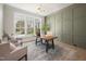 Stylish home office featuring a large window, statement desk, and comfortable seating at 4005 Brevard Pl, Raleigh, NC 27609