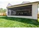 Screened in outdoor kitchen with seating and dining, great for entertaining guests at 4005 Brevard Pl, Raleigh, NC 27609