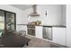 Outdoor kitchen featuring stainless steel appliances and ample counter space at 4005 Brevard Pl, Raleigh, NC 27609