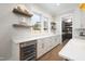 Bright pantry features a window, white cabinets, drawers, and gold hardware at 4005 Brevard Pl, Raleigh, NC 27609