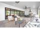 Well designed covered patio features lounge and cooking areas for entertaining at 4005 Brevard Pl, Raleigh, NC 27609
