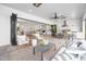 Inviting covered patio with seating and outdoor kitchen overlooking backyard at 4005 Brevard Pl, Raleigh, NC 27609