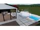 An inviting backyard with a modern pool and integrated spa, featuring stylish lounge furniture and patio at 4005 Brevard Pl, Raleigh, NC 27609