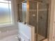 Bathroom features a shower and tub combo at 41 Faircox Way # 137, Garner, NC 27529