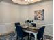 Formal dining room with hardwood floors, chandelier, and white table set at 41 Faircox Way # 137, Garner, NC 27529