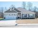 One-story home with gray siding, white garage doors, and a landscaped lawn at 41 Faircox Way # 137, Garner, NC 27529