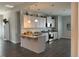 Modern kitchen with white cabinets, granite countertops, and stainless steel appliances at 41 Faircox Way # 137, Garner, NC 27529