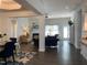 Open living space with hardwood floors, fireplace, and access to dining area at 41 Faircox Way # 137, Garner, NC 27529