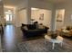 Spacious living room with hardwood floors, comfy seating, and coffee table at 41 Faircox Way # 137, Garner, NC 27529