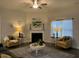 Cozy living room with fireplace, hardwood floors, and stylish seating at 41 Faircox Way # 137, Garner, NC 27529