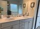 Well-lit bathroom featuring a double vanity with white marble countertops and modern fixtures at 41 South Faircox Way # 137, Garner, NC 27529