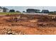 New home construction with foundation poured and framing started in a residential neighborhood at 41 South Faircox Way # 137, Garner, NC 27529