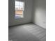 Bedroom with gray carpeting and a window overlooking a yard at 507 Barnes Landing Dr, Four Oaks, NC 27524