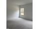 Simple bedroom with carpeted floors and one window at 507 Barnes Landing Dr, Four Oaks, NC 27524