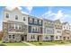 New townhome community with 3-story homes and attractive exterior finishes at 701 Lucky Clover Way, Fuquay Varina, NC 27526