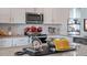 Kitchen island with granite countertop and various cooking essentials at 701 Lucky Clover Way, Fuquay Varina, NC 27526