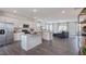 Open concept kitchen with large island and stainless steel appliances at 701 Lucky Clover Way, Fuquay Varina, NC 27526