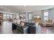 Spacious living room with hardwood floors, open concept design, and kitchen access at 701 Lucky Clover Way, Fuquay Varina, NC 27526