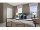 Bedroom with a bed, nightstands, and window view at 703 Lucky Clover Way, Fuquay Varina, NC 27526
