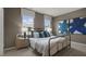 Bedroom with metal bed frame and blue art at 705 Lucky Clover Way, Fuquay Varina, NC 27526