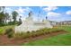 Welcoming Madden West community sign amid landscaped grounds and bright skies at 707 Lucky Clover Way, Fuquay Varina, NC 27526