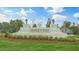 Madden West community entrance sign set amongst a landscaped green space at 707 Lucky Clover Way, Fuquay Varina, NC 27526