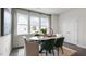 Bright dining area with a marble table and green velvet chairs at 707 Lucky Clover Way, Fuquay Varina, NC 27526