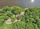 Aerial view of the property, highlighting its waterfront location and private setting at 10305 Old Creedmoor Rd, Raleigh, NC 27613