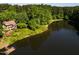 Stunning aerial view of lakefront property at 10305 Old Creedmoor Rd, Raleigh, NC 27613