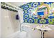 Stylish bathroom with blue and green wallpaper and pedestal sink at 10305 Old Creedmoor Rd, Raleigh, NC 27613