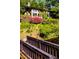 Wooden footbridge leading to lakefront home at 10305 Old Creedmoor Rd, Raleigh, NC 27613