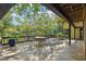 Spacious deck overlooking tranquil water, perfect for outdoor dining at 10305 Old Creedmoor Rd, Raleigh, NC 27613