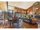 Bright dining area with hardwood floors and views of the outdoors at 10305 Old Creedmoor Rd, Raleigh, NC 27613
