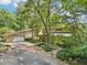 House exterior showcasing a split-level design and a two-car garage at 10305 Old Creedmoor Rd, Raleigh, NC 27613