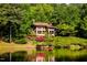 Luxury lakefront home nestled in lush woods with private dock at 10305 Old Creedmoor Rd, Raleigh, NC 27613