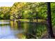 Picturesque waterfront view with lush greenery and calm water at 10305 Old Creedmoor Rd, Raleigh, NC 27613