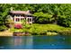 Lakefront home nestled in lush greenery at 10305 Old Creedmoor Rd, Raleigh, NC 27613