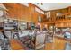 Spacious living room with high ceilings, wood paneling, and a cozy fireplace at 10305 Old Creedmoor Rd, Raleigh, NC 27613