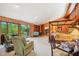 Large main bedroom with a four-poster bed, fireplace, and access to a balcony at 10305 Old Creedmoor Rd, Raleigh, NC 27613