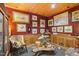 Charming office features wood walls, framed artwork, and a wood chair at 10305 Old Creedmoor Rd, Raleigh, NC 27613